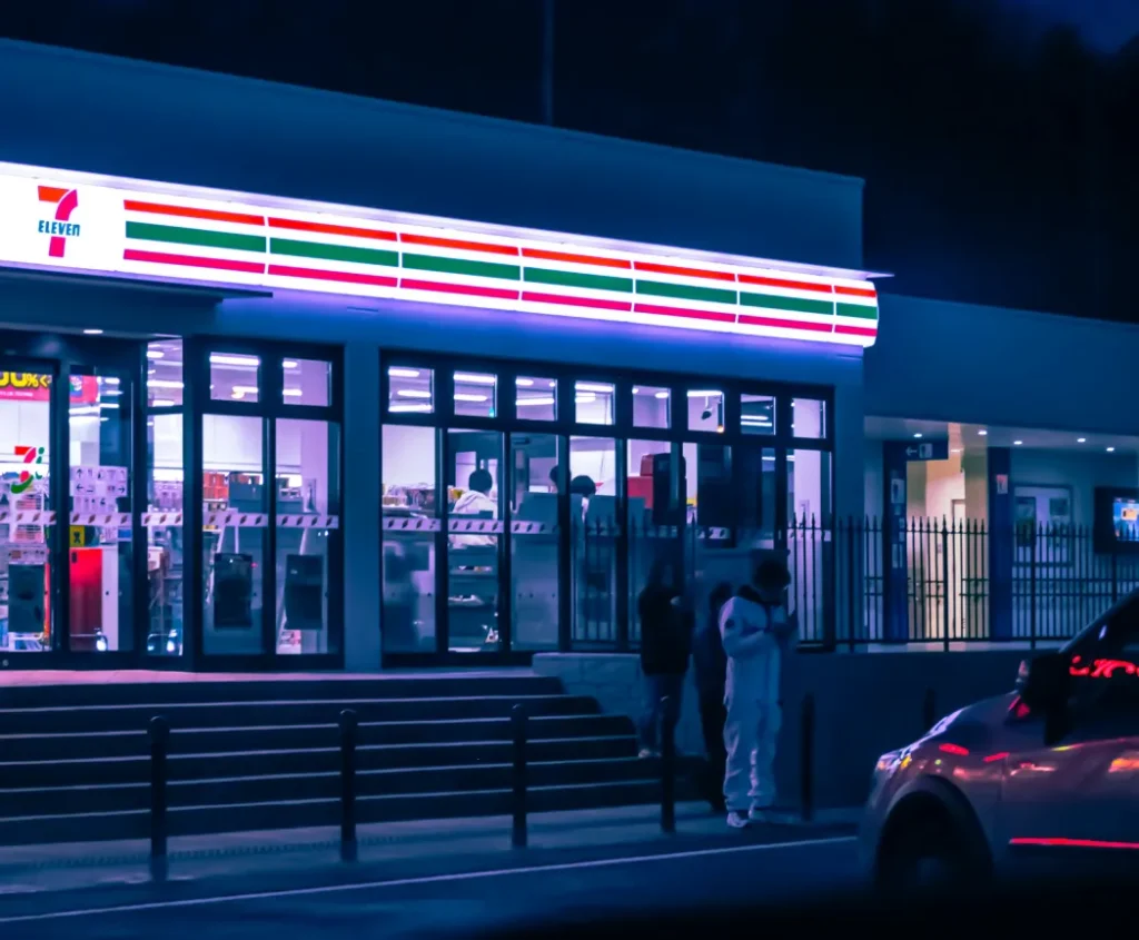 Illuminated 7 Eleven convenience store at night